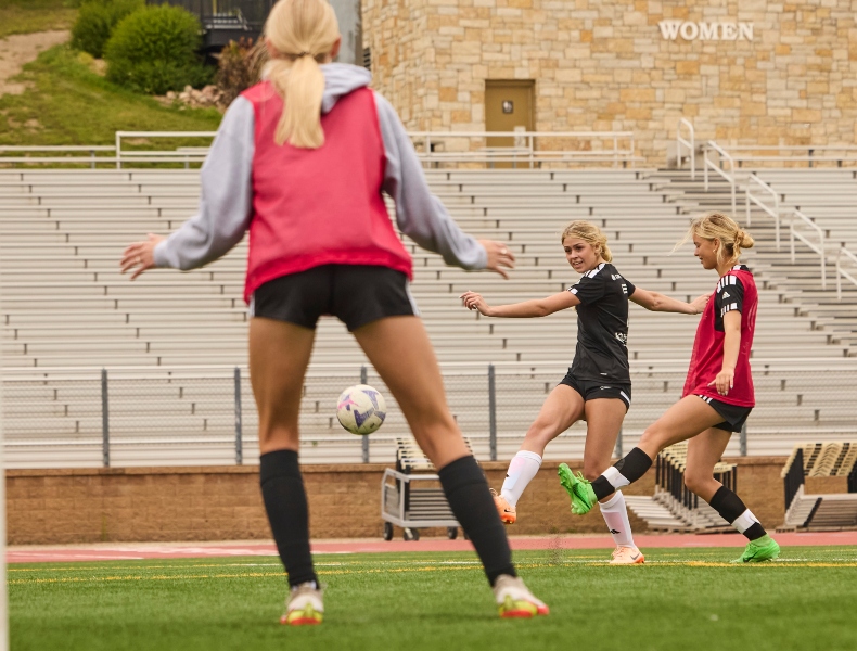 Girls practicing soccer.