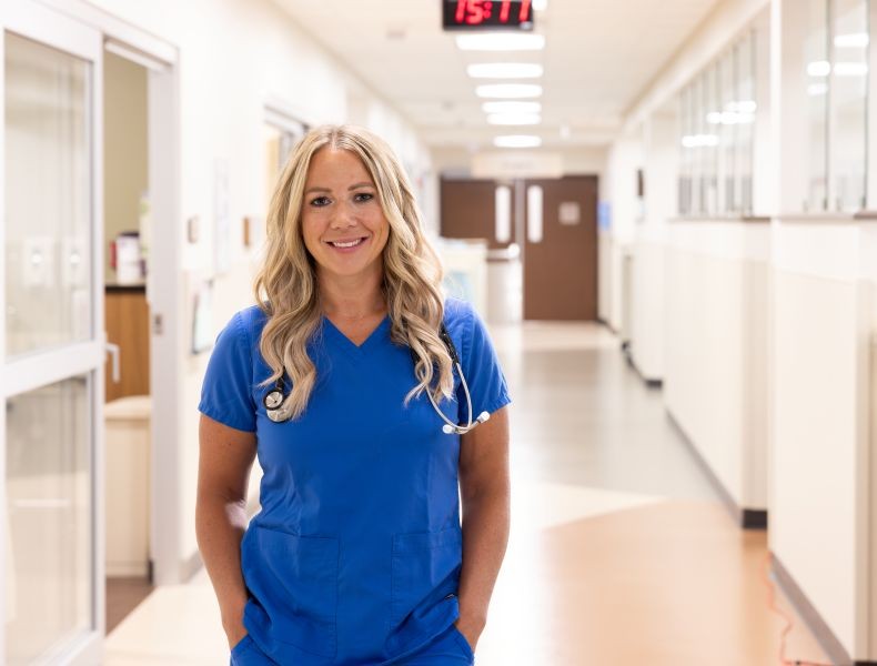 Nurse standing in the hallway.