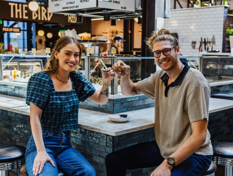 Man and a woman having dinner out.